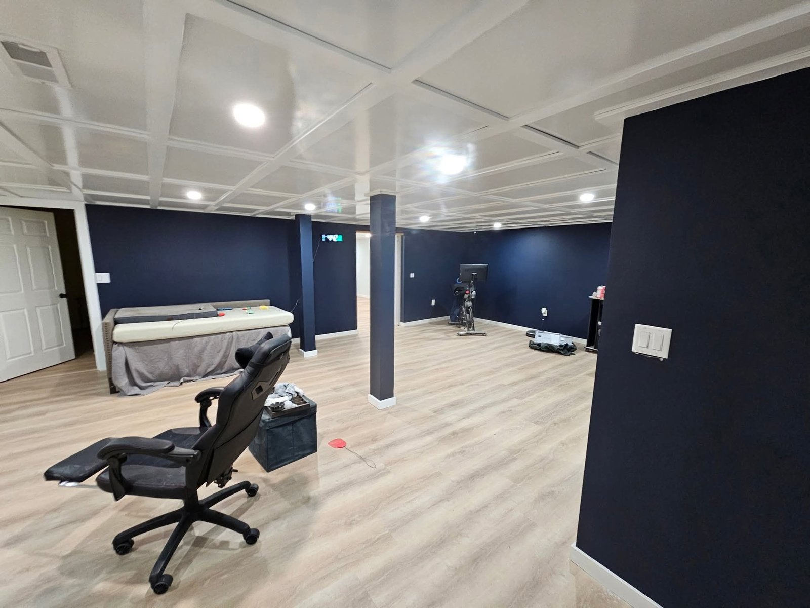 Finished basement navy walls